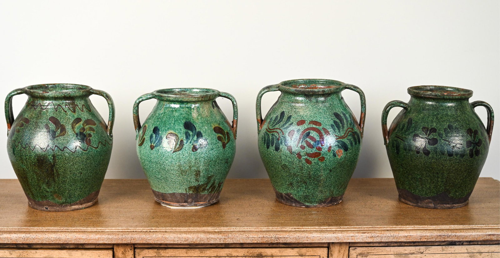 (4) LILLIAN AUGUST FRENCH EARTHENWARE POTTERY URNS: Dimensions: H 12" x Dia. 12" Condition: Intentionally antiqued finish, with a few chips to bottom feet (possibly inherent)