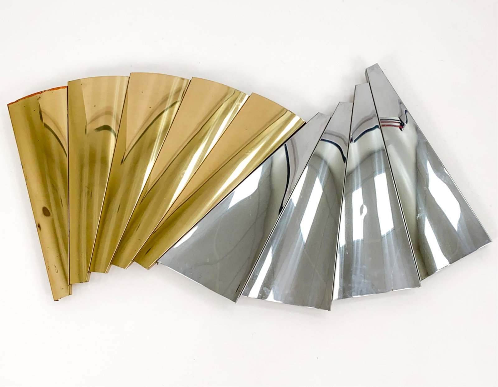 C. JERE BRASS & STEEL WALL SCULPTURE: Double fan pattern. Dimensions: H 28" x W 58" Condition: Some surface discoloration to a few panels; a few dings.