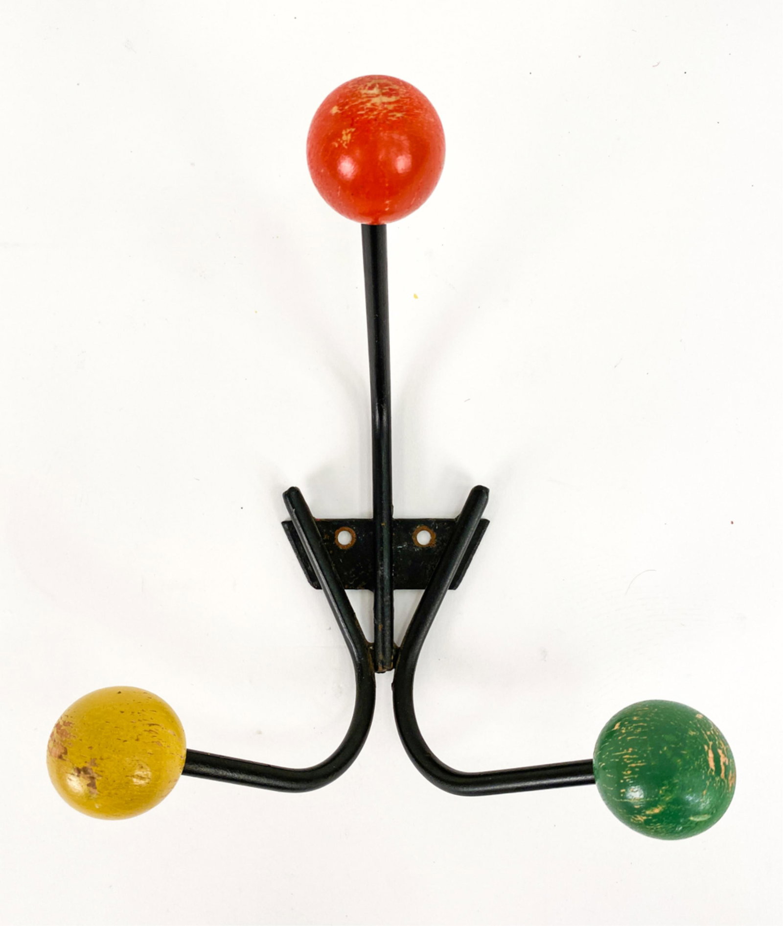 MID-CENTURY ATOMIC FRENCH COLORFUL BALL COAT HOOK: Black-painted iron with three colorful wooden balls. No markings. Dimensions: H 8.5" x W 8" x D 5.5" Condition: Some rubbing and paint losses.