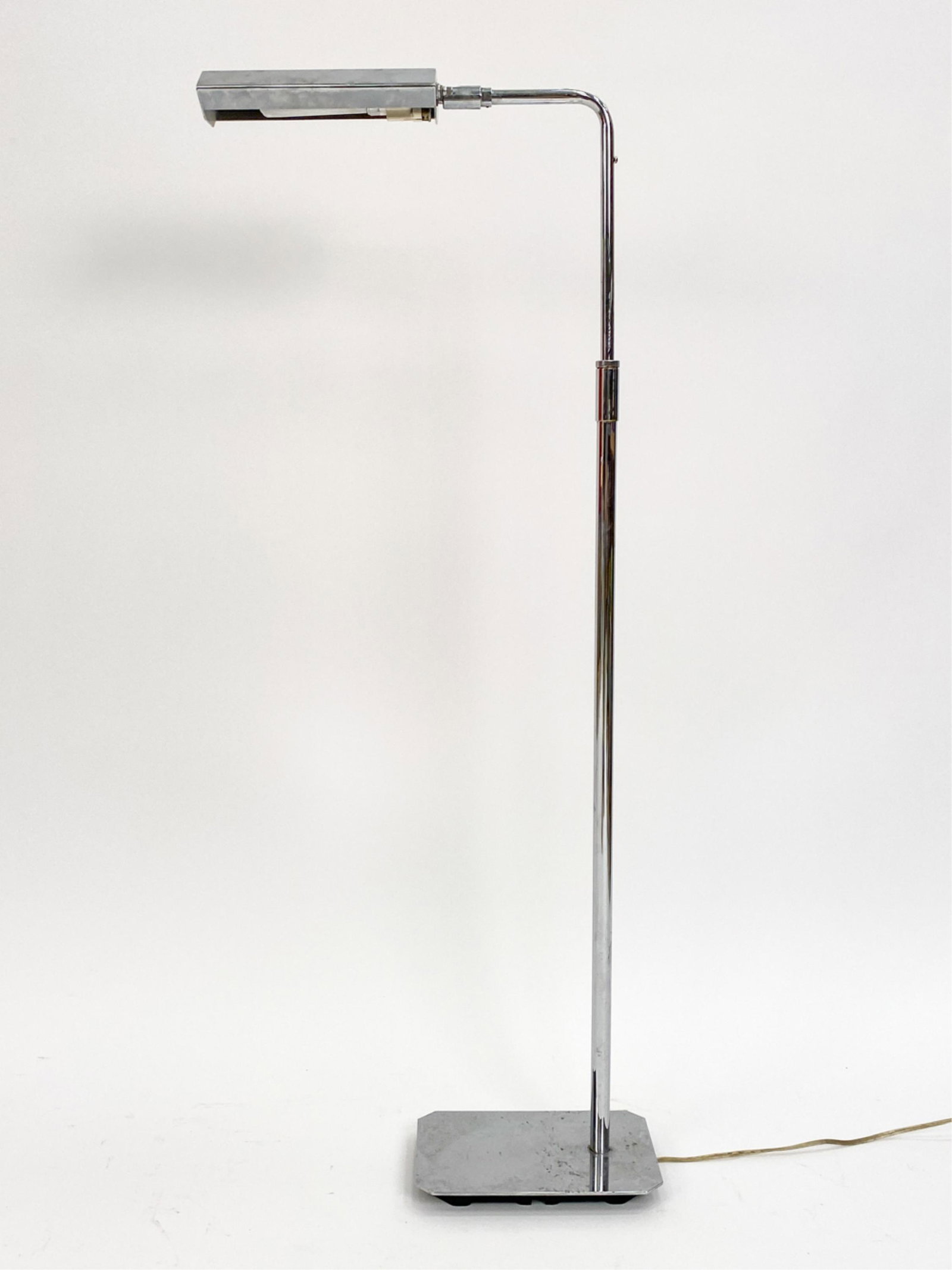 KOCH & LOWY CHROME FLOOR LAMP: Marked Koch & Lowy near lamp head. Adjustable. Dimensions: H 43" x W 6.25" x D 16.5" Condition: Surface wear, scratches and tarnish consistent with age and use.