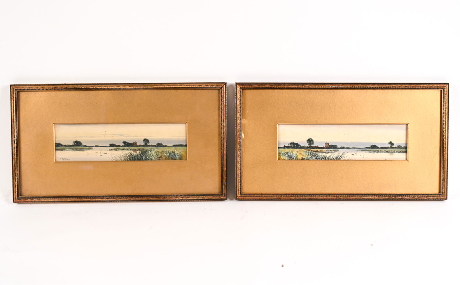 (2) FREDERICK GORDON FRASER, BRITISH (1879-1940): Pair of watercolor marsh landscapes. Both signed F.G. Fraser. Dimensions: (Frame) H 8.75" x W 15.75" (Sight) H 2.75" x W 9.75" Condition: One frame lacking glass, handling wear to mat. Light surface d