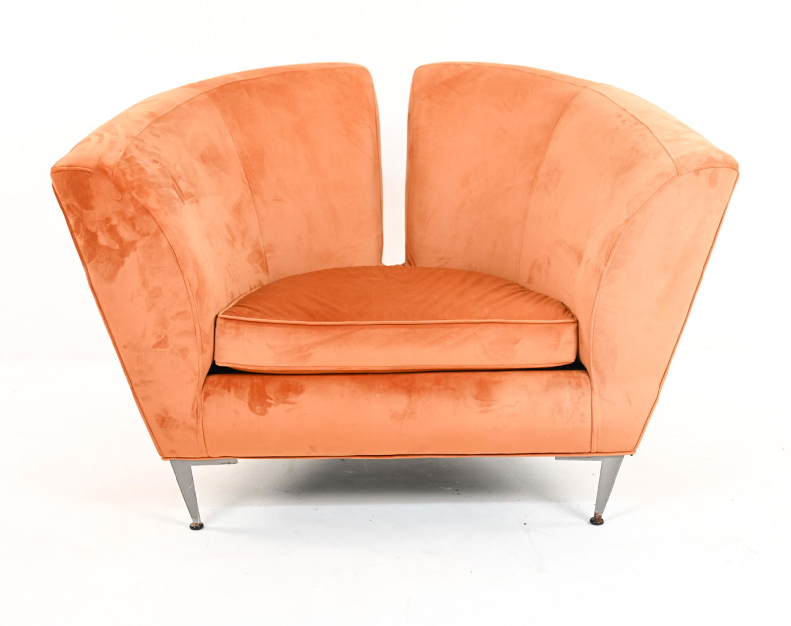 MANNER OF MILO BAUGHMAN POSTMODERN CLUB CHAIR: Sculptural armchair in pumpkin ultrasuede velvet with steel legs. Apparently unlabeled, in the manner of Milo Baughman. Contemporary. Dimensions: H 34" x W 50 " x D 34 " x SH 18" Condition: Light wear