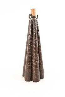 MANNER OF PAUL DUPRE-LAFON ALLIGATOR LEATHER LAMP: Mid-century French scalloped table lamp in brown alligator leather hide, manner of Paul Dupre-Lafon. Apparently unmarked. Dimensions: H 18.75" x Dia. 6.25" Condition: Not tested. Socket fixture loose.