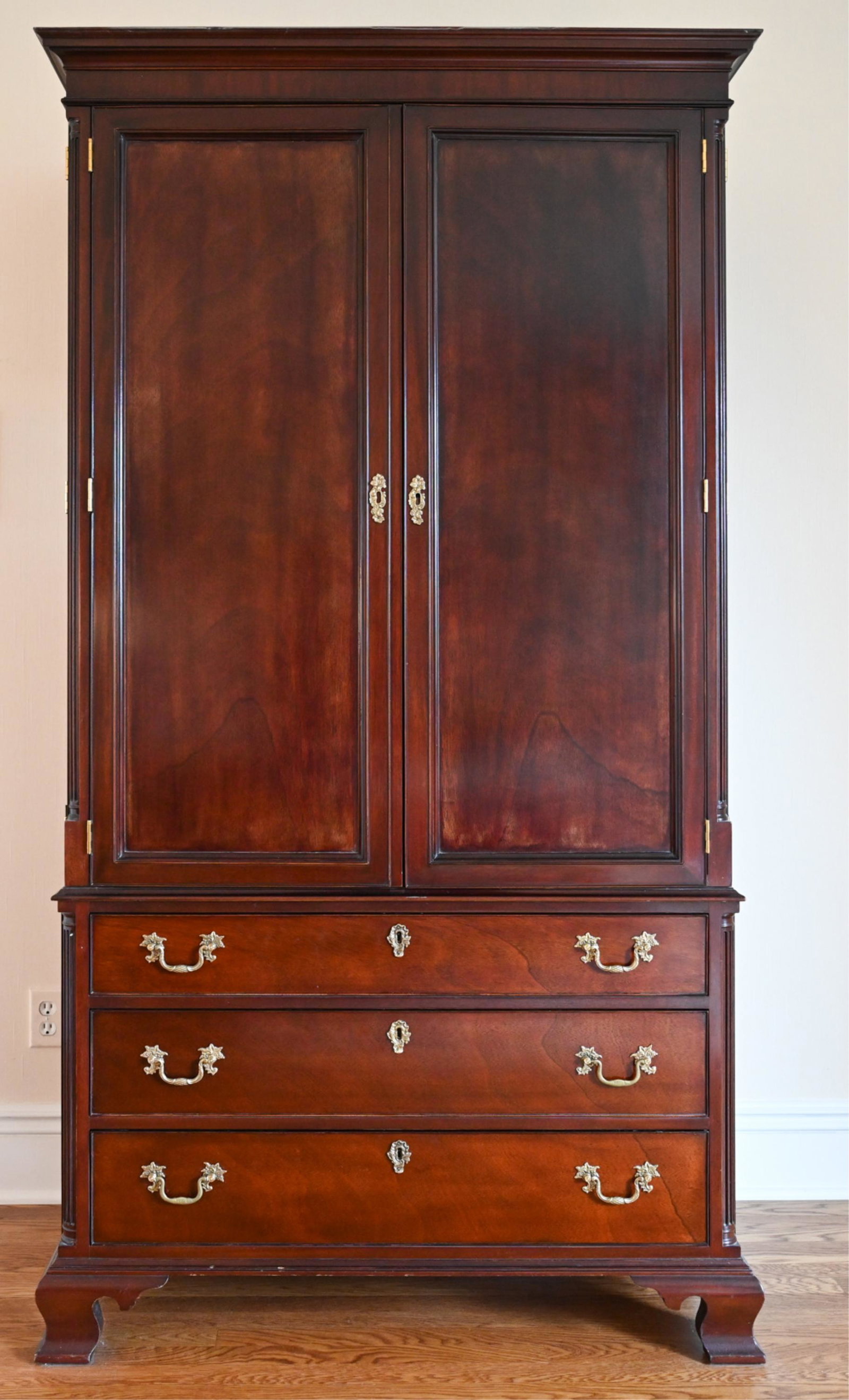 KINDEL MAHOGANY LINEN PRESS: Heat-stamped Kindel to drawer interior. Fine mahogany linen press cabinet. Dimensions: H 80" x W 43.25" x D 23.75" Condition: Few nicks, dings, and rubs. Light wear consistent with use.