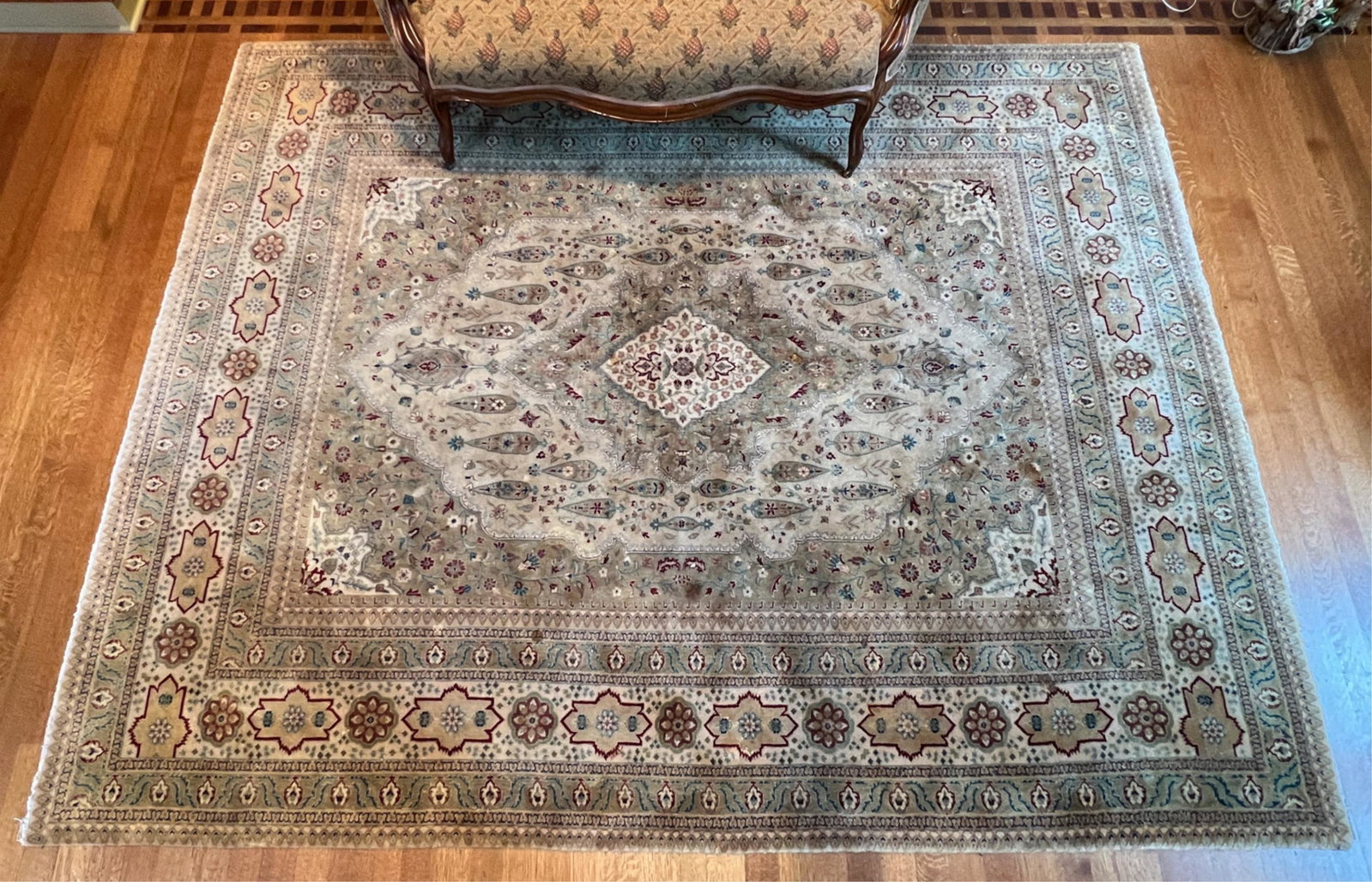 HAND-KNOTTED AREA RUG: Plush wool or wool-silk blend. Dimensions: L 118.5" x W 94.5" Condition: Cleaning recommended; spots of moderate soiling and discoloration; some sun fading, spots of soiling and discoloration.
