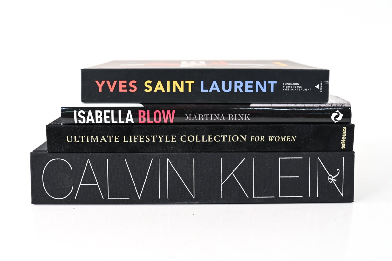 (4) FASHION BOOKS: Dimensions: (Largest, Calvin Klein) H 14.5" x W 11.25" x D 2.5" Condition: Showing light handling wear consistent with age and use; minor sun fading, some blunting to corners and wear to dust jackets,