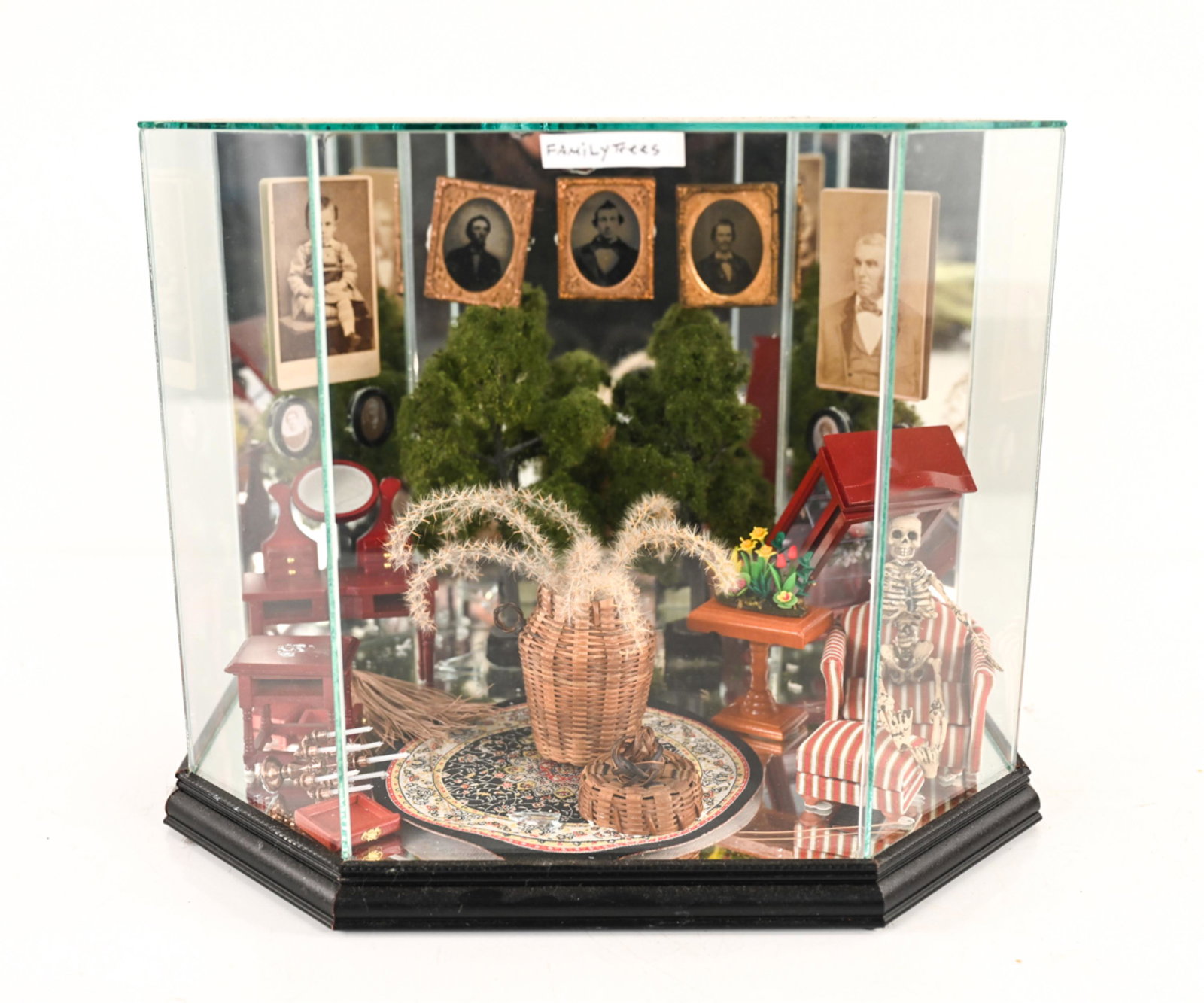ROLAND ROBERGE (1945-2020) DIORAMA: Found-object sculpture in glass diorama. Titled "Family Trees". Dimensions: H 12.25" x W 15.5" x D 12" Condition: Cracks and losses to glass. Wear consistent with age. Elements may be detached, broken