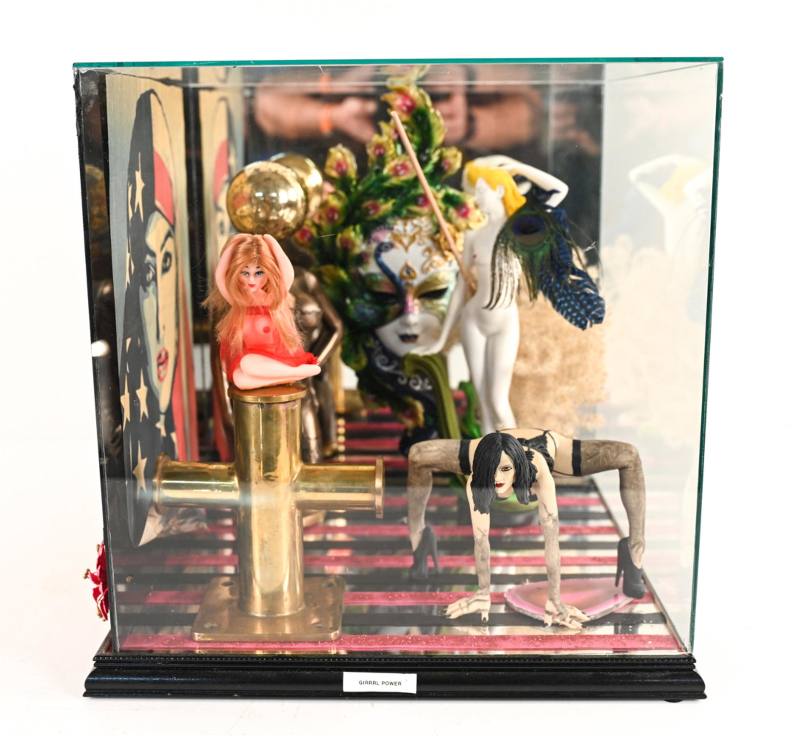 ROLAND ROBERGE (1945-2020) DIORAMA: Found-object sculpture in glass diorama. Titled "GIRRRL POWER". Dimensions: H 15.25" x W 15.25" x D 15.25" Condition: Wear consistent with age. Elements may be detached, broken, or missing. Scuffs to 