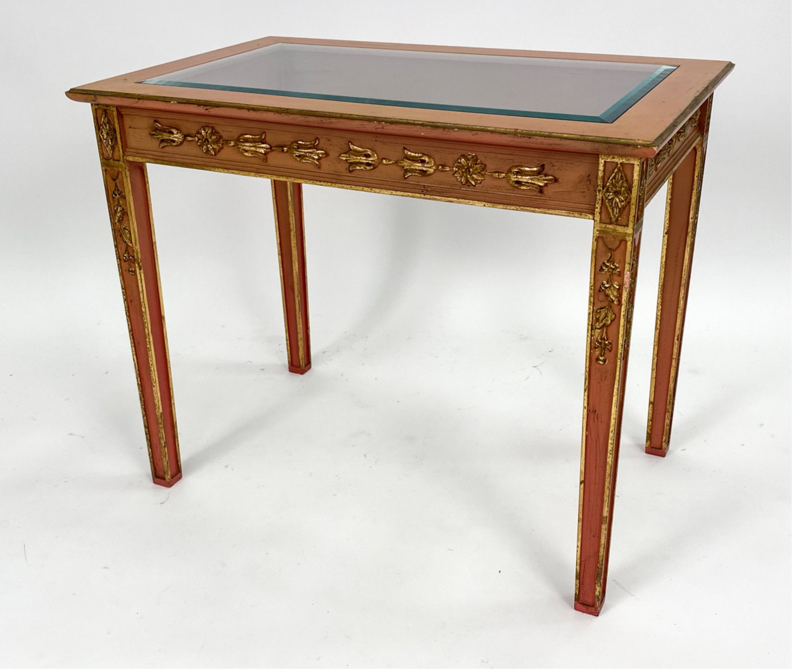 VINTAGE EMPIRE-STYLE GLASS TOP TABLE: Painted and faux gilded, with beveled glass insert. Dimensions: H 25" x W 31" x D 19.5" Condition: Scratches, edge wear, losses.
