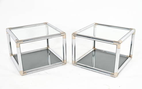 (2) MANNER OF MASCHERONI TUBULAR CHROME END TABLES: Pair of open cube end tables in tubular bent chrome, with brass-finished corners, clear glass tops and smoked glass bottom tiers. In the manner of John Mascheroni or Paul Tuttle, c. 1970's. Dimensions