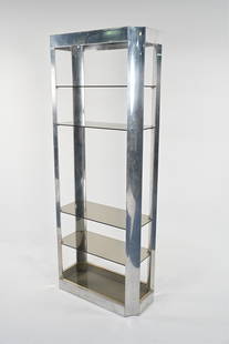 CHROME ETAGERE IN THE MANNER OF RENATO ZEVI: Chrome and brass, with smoked glass shelves. C. 1970's. Dimensions: H 74" x W 30.25" x D 14.25" Condition: May be missing one shelf. Chrome and brass with surface scratches, scuffing and a few pits. A