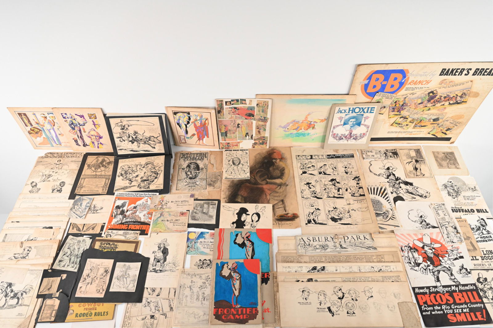 ALONZO VINCENT (JACK) WARREN (1886-1955) ARCHIVE: Extensive portfolio and archive of the cartoonist and Pulp Western illustrator Jack A. Warren, including many original signed cartoon strips and paintings; original drawings and advertising mock-ups f