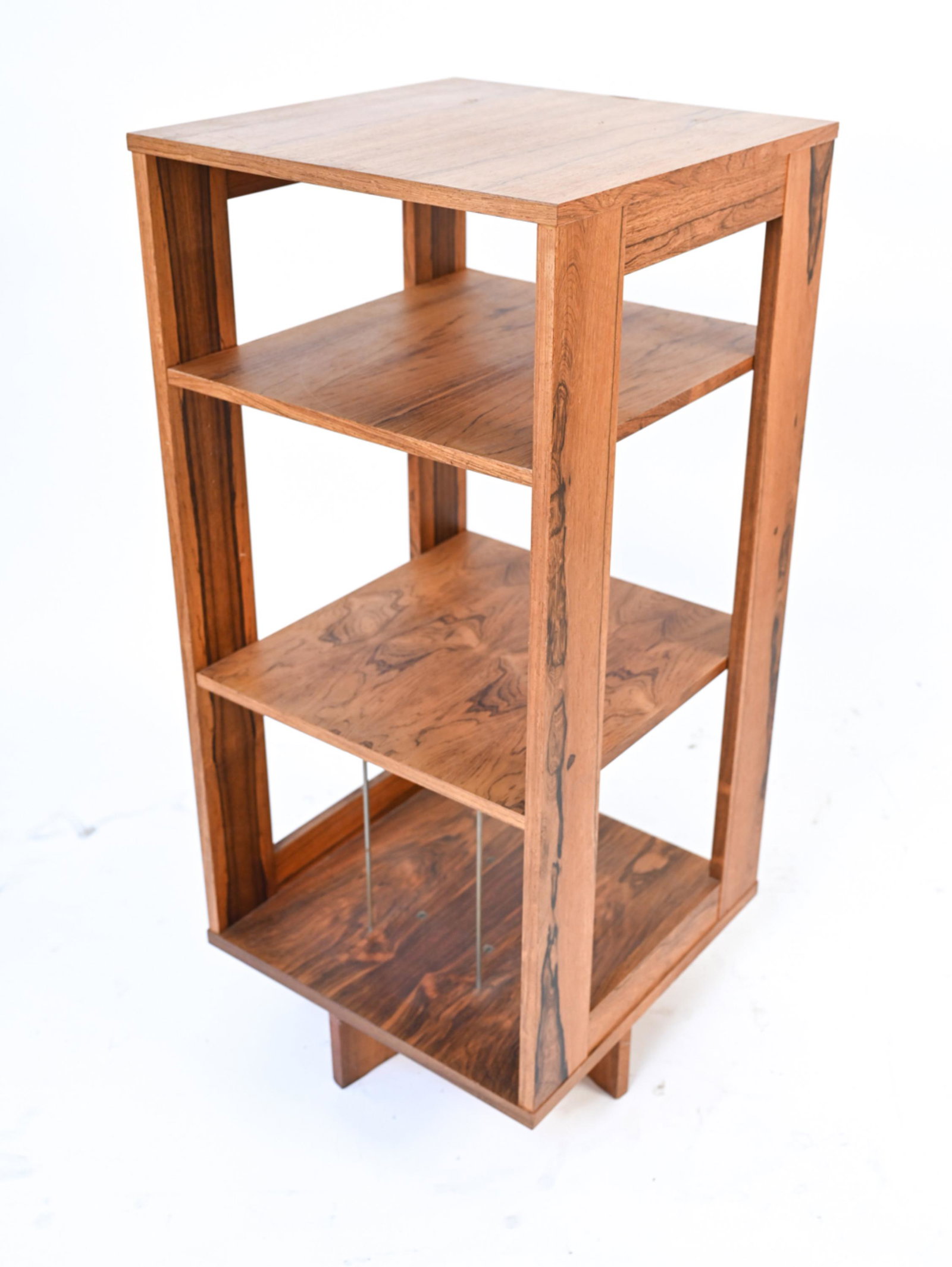 DANISH MID-CENTURY ROSEWOOD REVOLVING BOOKCASE: Apparently unsigned. Dimensions: H 43.5" x W 19.75" x D 19.75" Condition: As-is; significant sun fading throughout, missing pins for one shelf, apparently missing one pair of metal rod dividers for lo