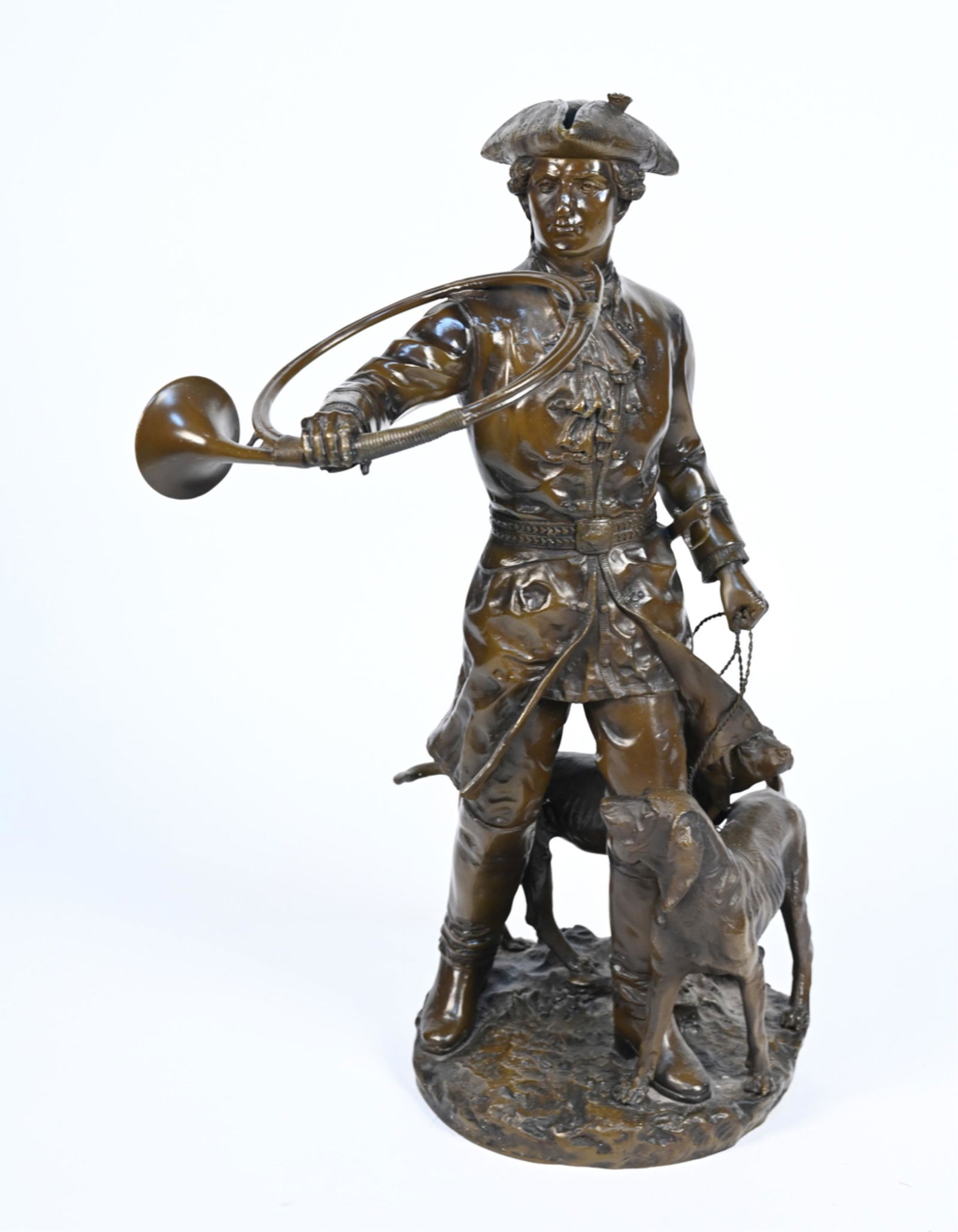 REPRODUCTION BRONZE SCULPTURE AFTER MOREAU: After "Hunter with His Dogs" by Hippolyte Moreau. Appears to be bronze cast over composite. Dimensions: H 38" x W 26" x D 17" Condition: A few small losses to bronze. Intentionally patinated finish, w