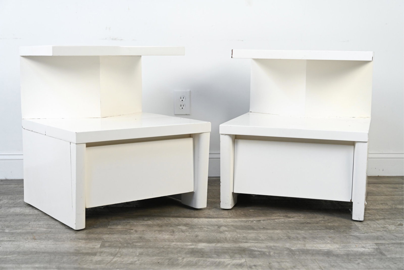 PAIR OF WHITE LACQUERED MID-CENTURY NIGHTSTANDS: Dimensions: H 25" x W 21" x D 22.5" Condition: As-is, in need of refinishing; lacquer with cracks, chips, soiling and losses.