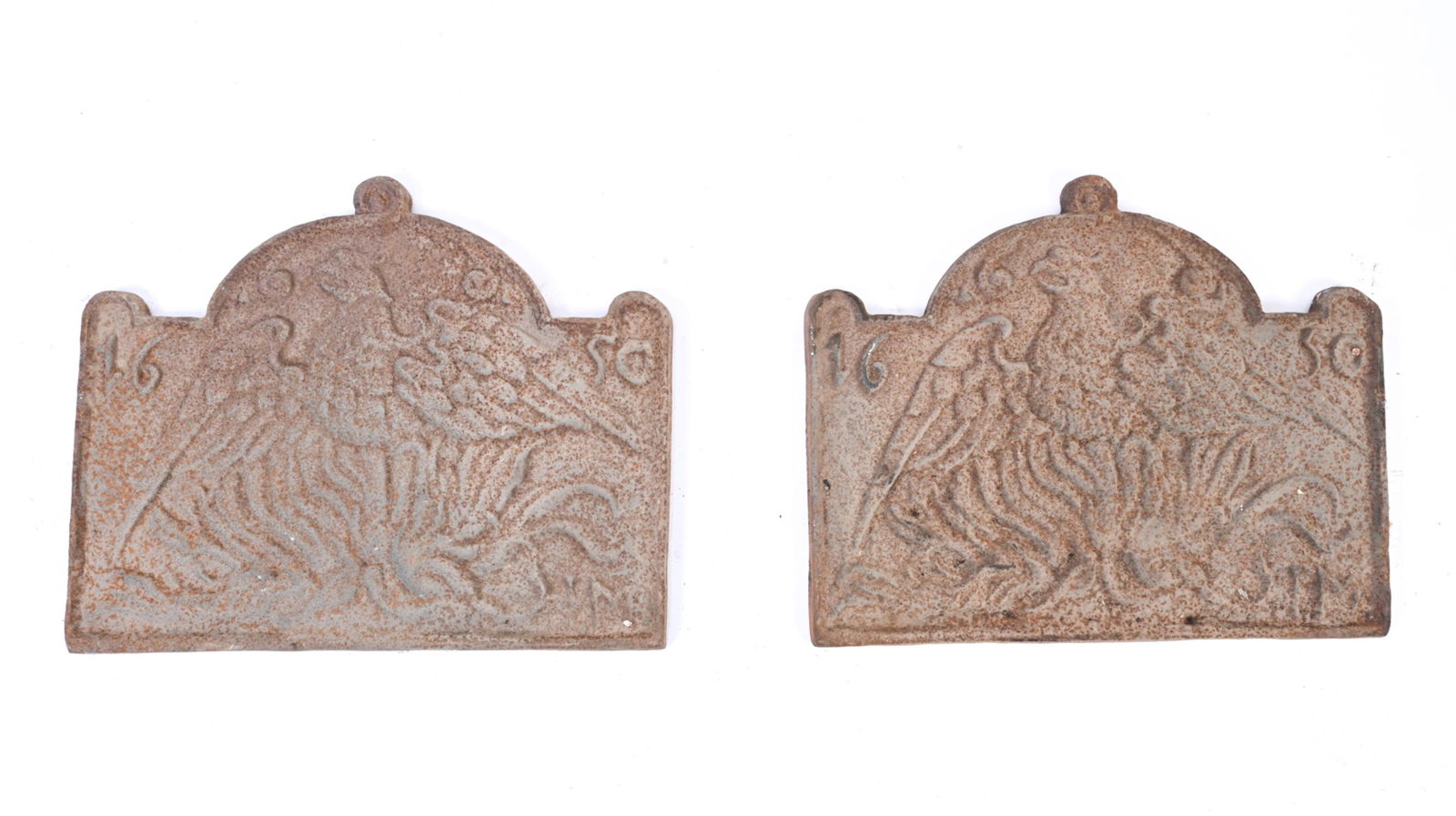 PAIR OF CAST IRON STOVE PLATES DATED 1650: 20th c. casting. With eagle motifs and indistinct initials. Dimensions: H 21" x W 26" x D 1.25" Condition: Oxidation, patina and wear consistent with age and use.