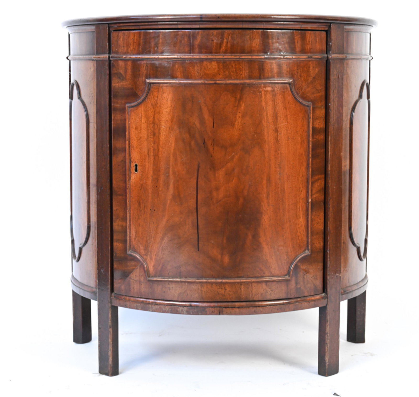 ANTIQUE MAHOGANY DEMILUNE CABINET: C. Early 19th Century; possibly English Regency. With oak interior shelves. Dimensions: H 31" x W 30" x D 17.5" Condition: Missing key. Wood previously refinished; repaired cracks to veneer. Top with 