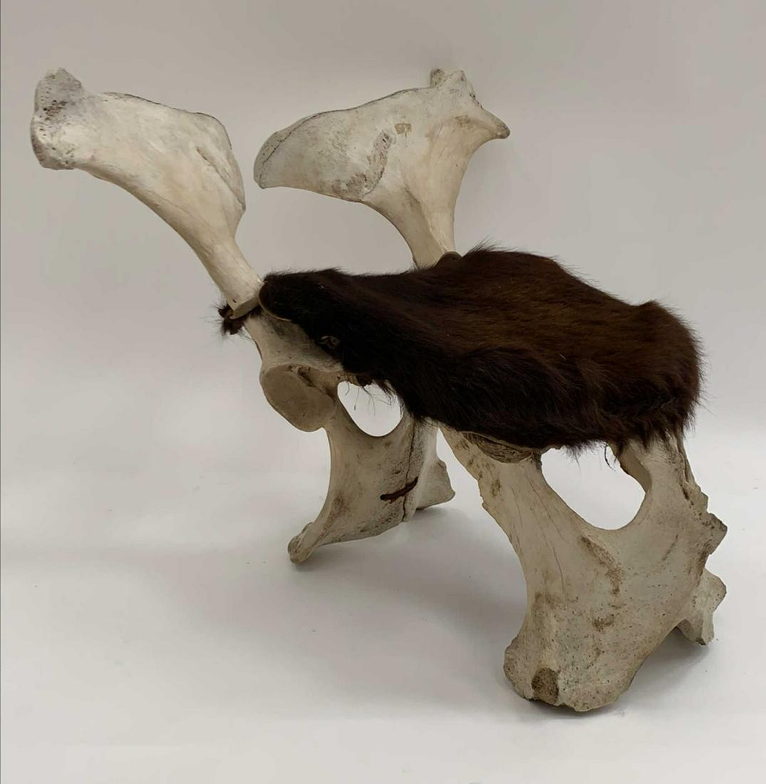 BONE AND HIDE FOOTSTOOL: Dimensions: H 18.5" x W 22" x D 24.5" x SH 11.5" Condition: Spots of soiling, chips to bone; wear consistent with age and use.