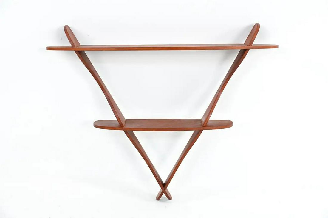 ATTR. PEDER MOOS DANISH MID-CENTURY WALL SHELF: A Danish mid-century organic triangular-form wall-mount two-tier shelf in teak wood, attributed to eccentric designer Peder Moos, 1950's. A stylish and functional example of Scandinavian modern design