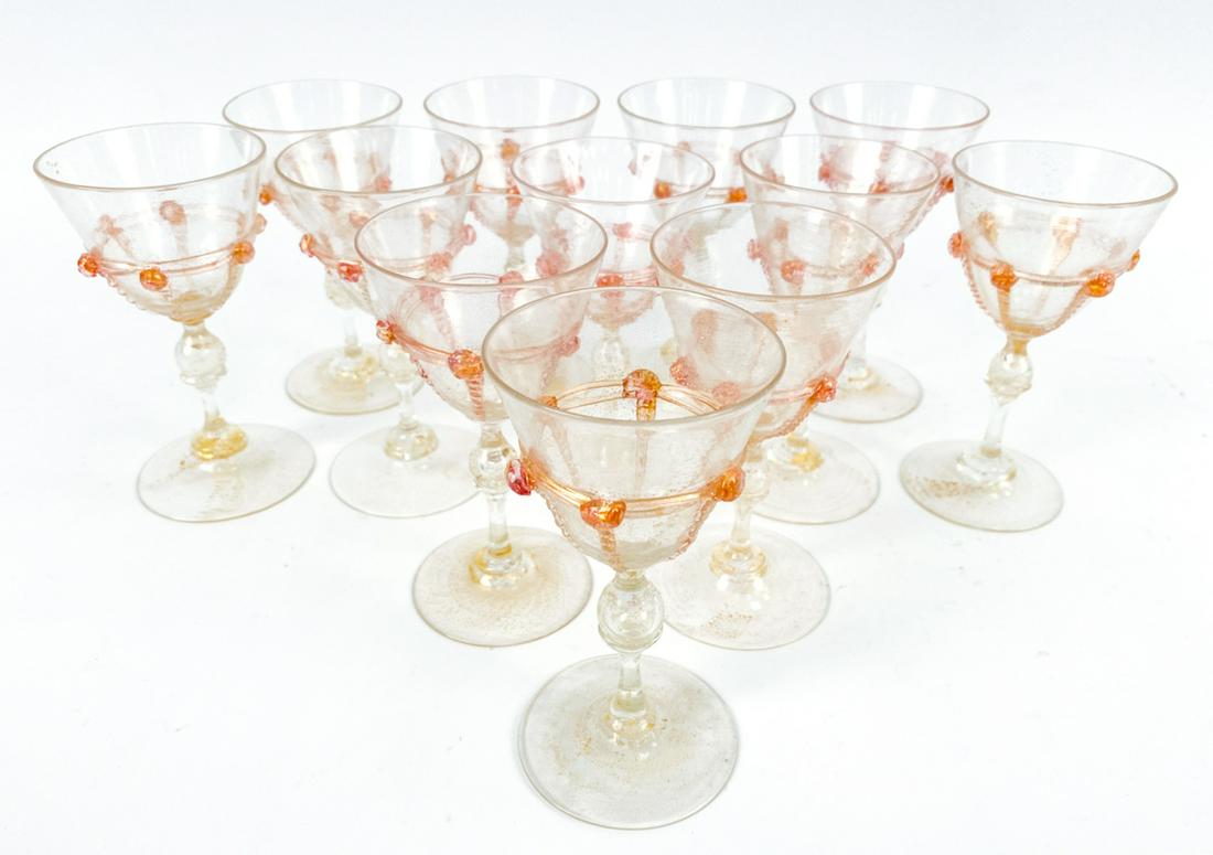(12) ITALIAN GOLD-FLECKED CORDIAL GLASSES: (12) hand-blown gold flecked cordials. Unsigned. Dimensions: H 5" x Dia. 2.75" Condition: Light use wear.