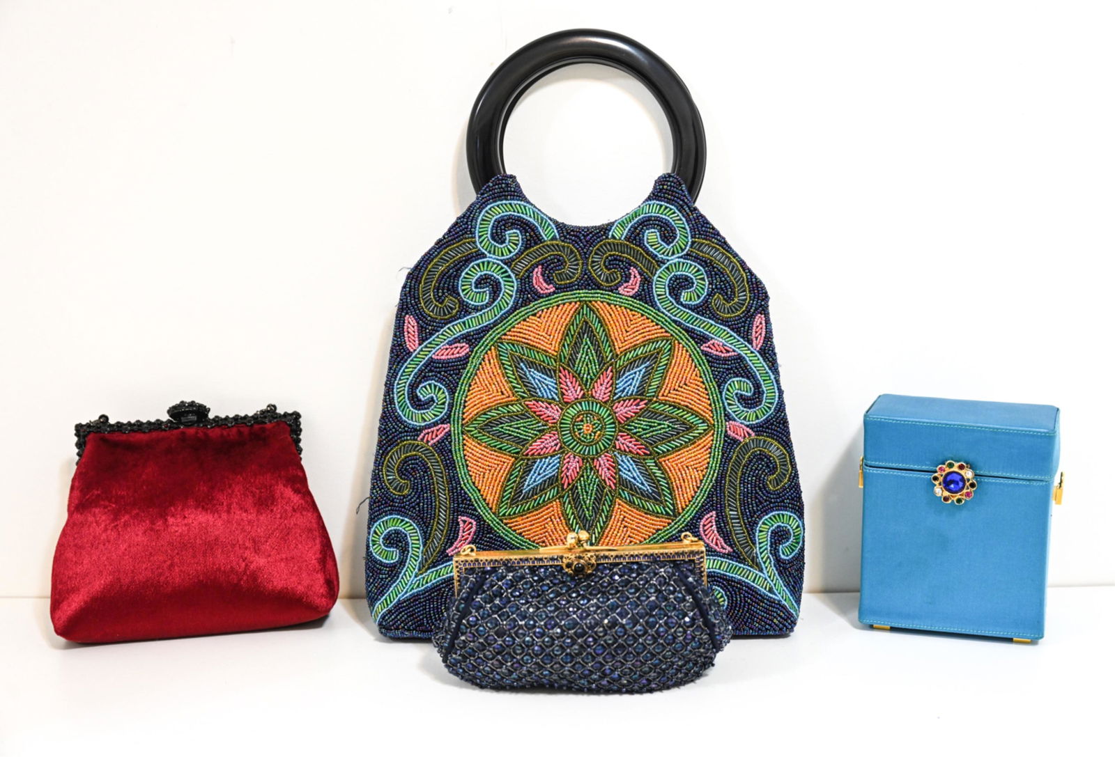 (4) VINTAGE DESIGNER EVENING BAGS: Including a jeweled satin box clutch by Susan Bennis Warren Edwards, velvet frame bag by Larisa Barrera, small kisslock bag by Revivals, and large beaded bag, apparently unmarked. Dimensions: (Largest