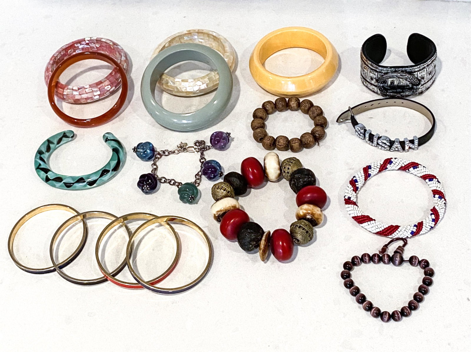 VINTAGE COSTUME JEWELRY BRACELET GROUPING: Dimensions: (Widest cuff) L 3" x W 1.5" x D 2" Condition: Showing various signs of wear consistent with age and use; a few may need re-stringing and/or small repairs.