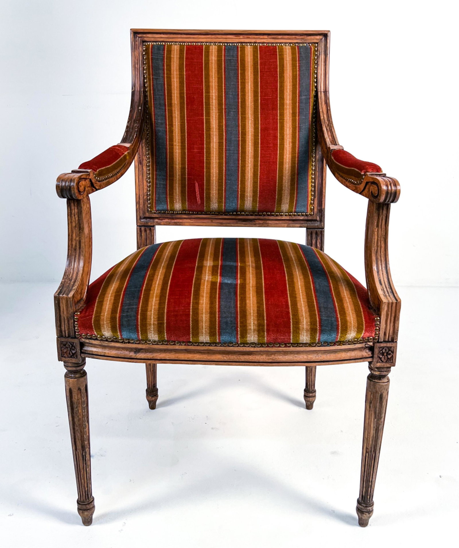 MID-CENTURY LOUIS XVI-STYLE MOHAIR FAUTEUIL CHAIR: Armchair in the Louis XVI style with traditional French moldings and striped mohair chenille upholstery; labeled W. & J. Sloane, Inc. under seat. C. Mid-20th Century. Dimensions: H 38" x W 24" x D 23"