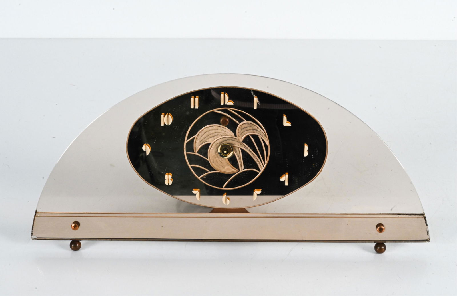 ART DECO GENERAL ELECTRIC ROSE GLASS MANTEL CLOCK: Marked to back of movement. Dimensions: H 8" x W 17" x D 2" Condition: Untested. Second hand detached, others lacking. Few small spots of desilvering to mirroring. Chip to one corner of glass.