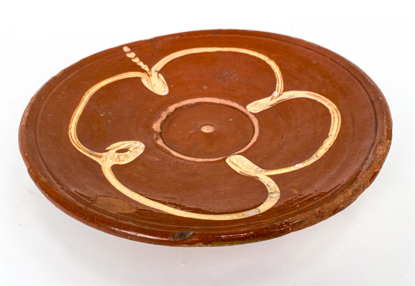 FRENCH ANTIQUE OMELET POTTERY: A kitchen piece for daily flipping omelets and discarding the oil. Dimensions: H 2" x Dia. 9.75" Condition: Crack at rim. Scattered chips and glaze losses.