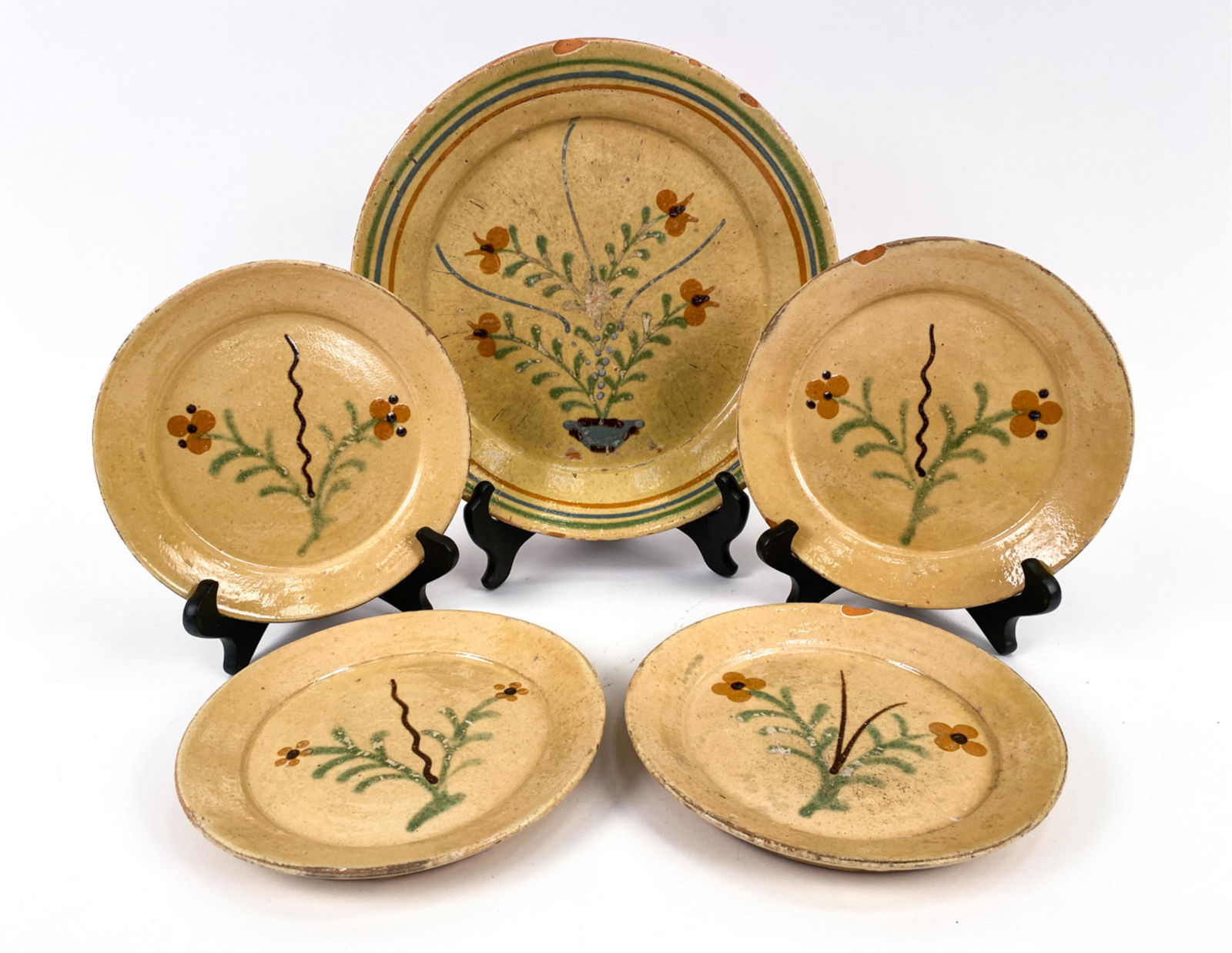 (5) FRENCH ANTIQUE PLATTER & PLATES: Cheese service served in a brasserie. Platter and four plates. Made in Marnaz. Dimensions: (Largest) H 1.5" x Dia. 12.25" Condition: Scattered old chips and losses. Scratches and surface wear.