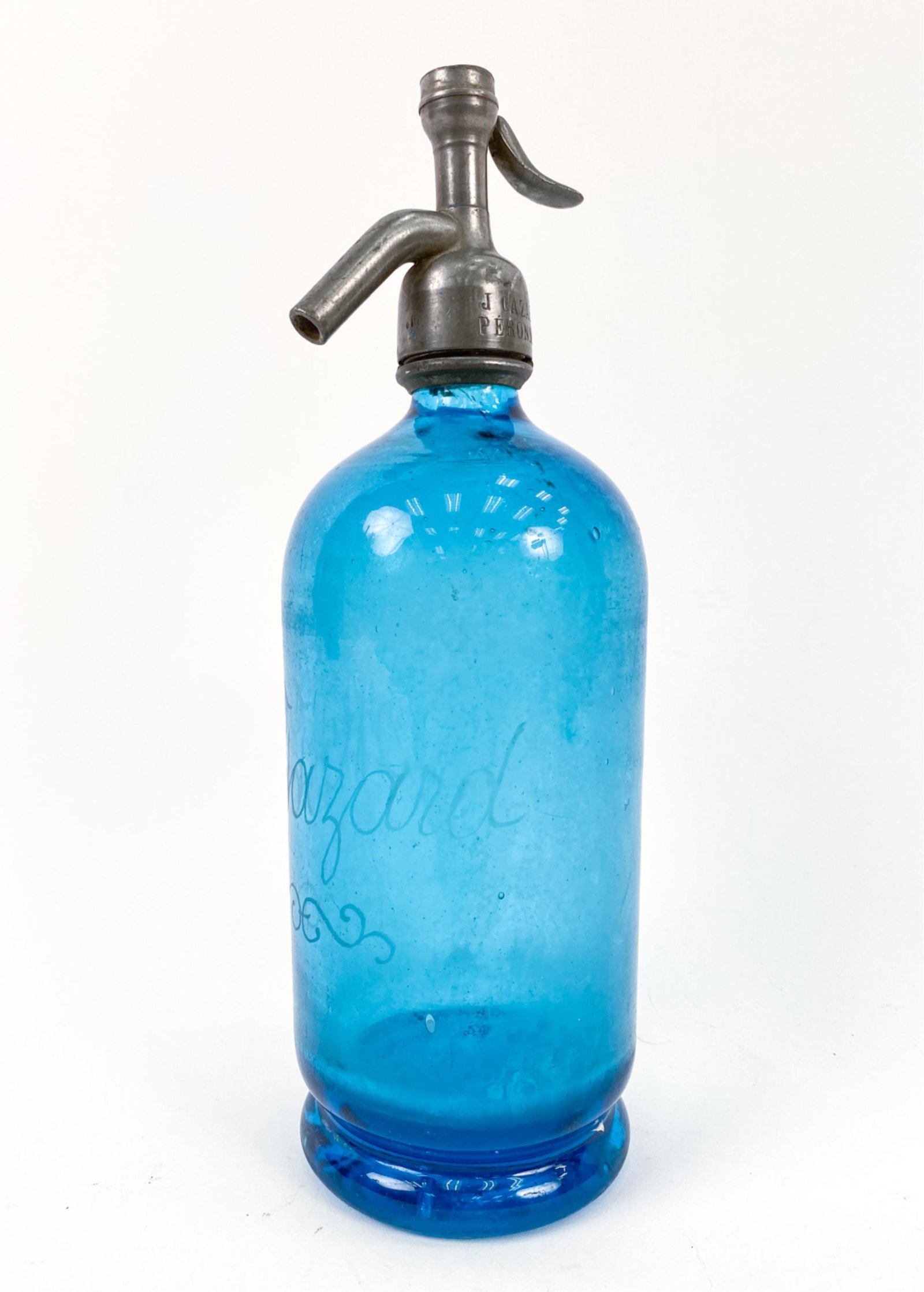 1920 FRENCH BISTRO SELTZER BOTTLE: Blue seltzer bottle with the name sketched on the interior of the glass. Made in Paris by Renaud for the restaurant "J. Cazard Peronne." Bistro located in the WWI region of the Somme. Dimensions: H 11