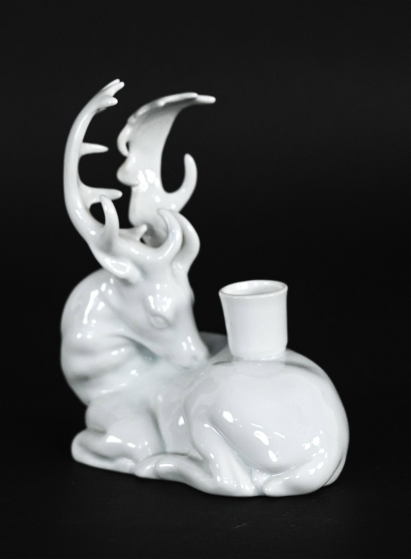 PETITES CHOSES PORCELAIN STAG CANDLEHOLDER: Labeled underneath. Dimensions: H 7" x W 7" x D 3" Condition: No issues to note.