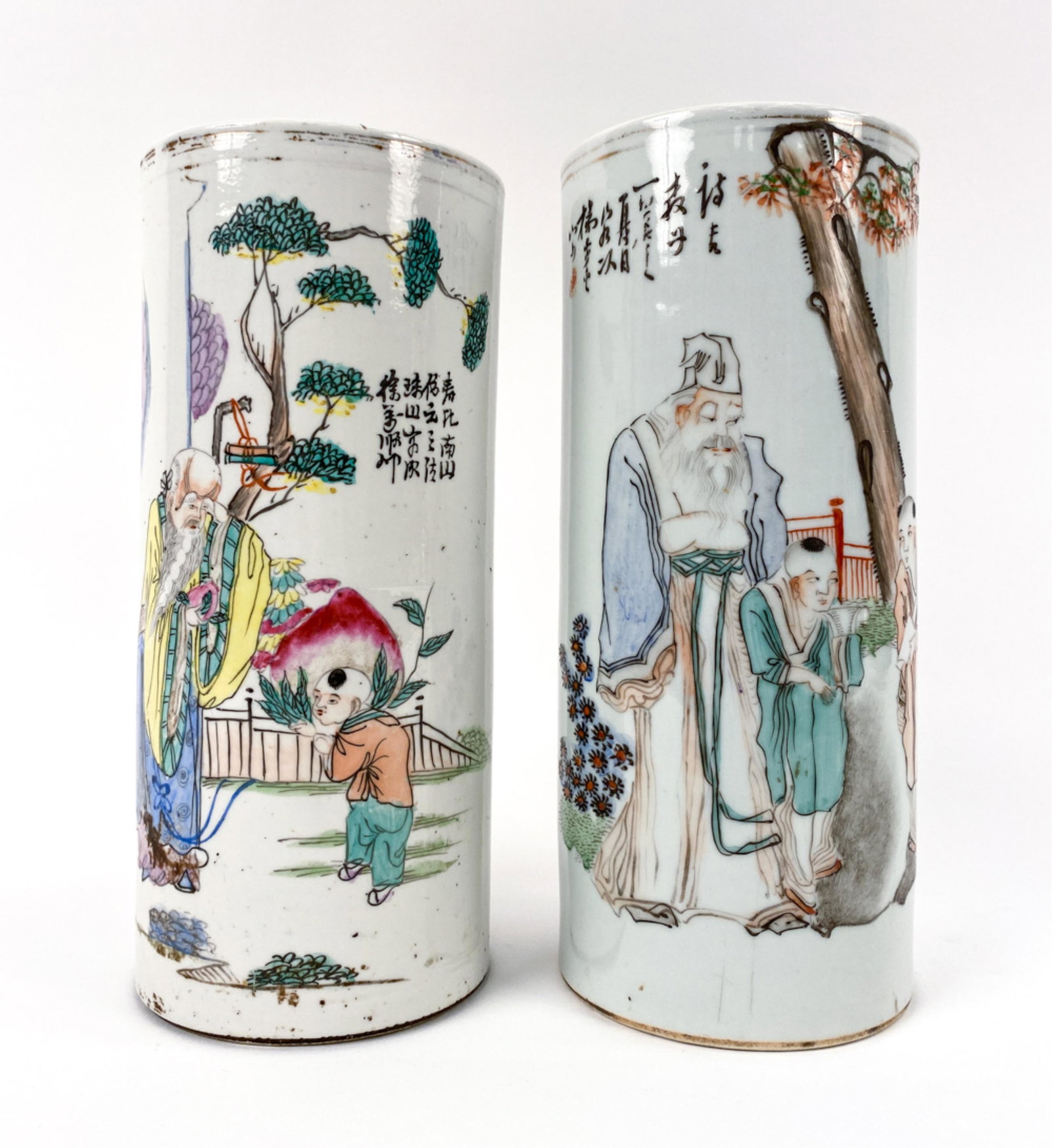 (2) CHINESE FAMILLE VERTE BRUSH POTS: Both marked underneath. Both with inscriptions. Enamel decorated. One slightly taller. Dimensions: (Taller) H 11" x Dia. 4.75" Condition: Both with gold at top edge rubbed.