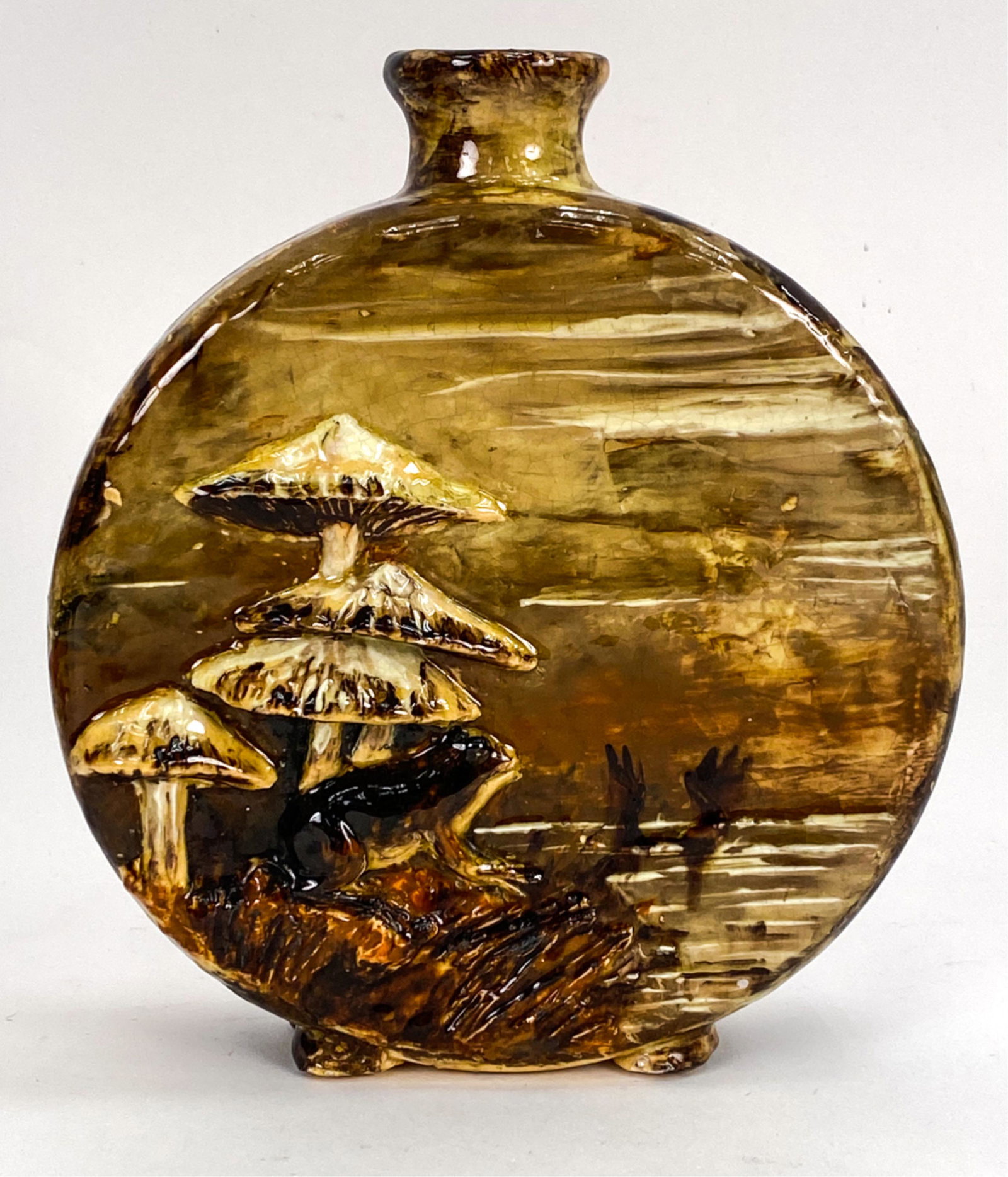 1880 JAPONISME BARBOTINE VASE, SIGNED: Moon flask form vase with frog and mushrooms. Marked A.V. 1880 underneath. Also marked JFH on side. Possibly Albert Valencia. Dimensions: H 8.25" x W 7" x D 2.5" Condition: Some crazing. Glaze lifting