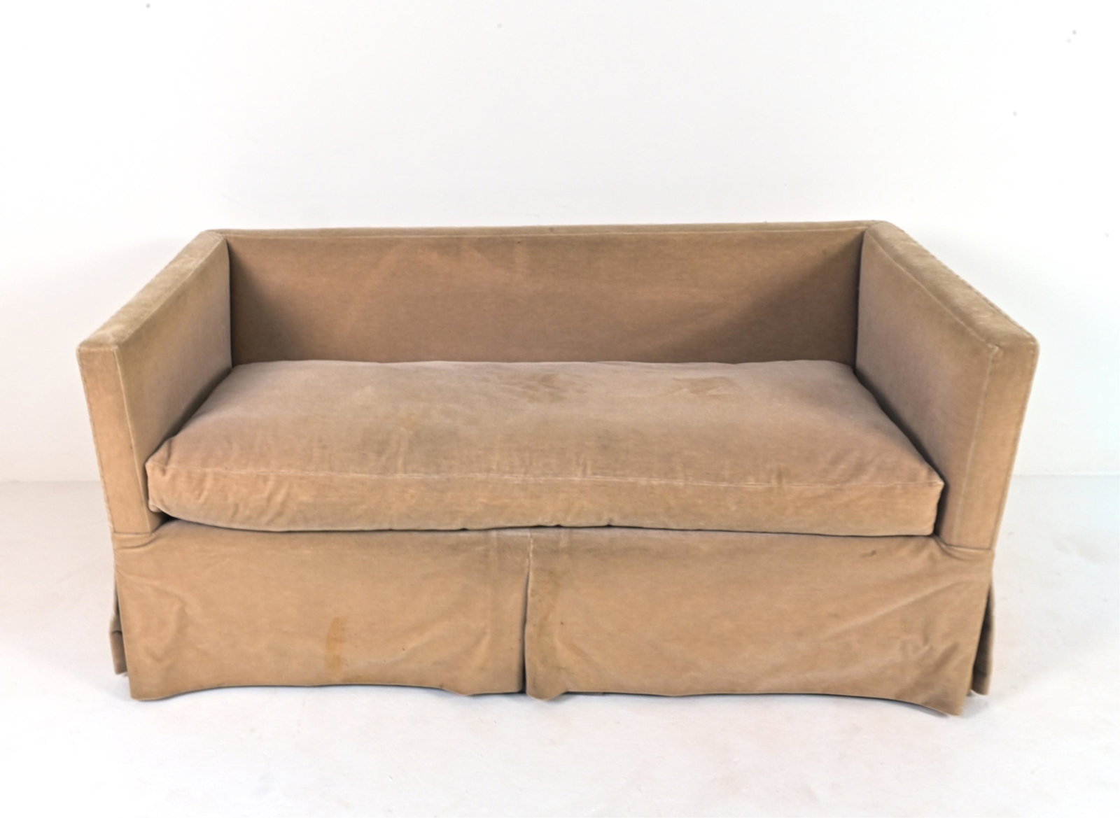 MID-CENTURY MOHAIR LOVESEAT: Apparently unlabeled. Dimensions: H 27" x W 60" x D 30" x SH 18" Condition: In need of cleaning or reupholstering; soiling and discoloration throughout, some flattening to cushion fill.