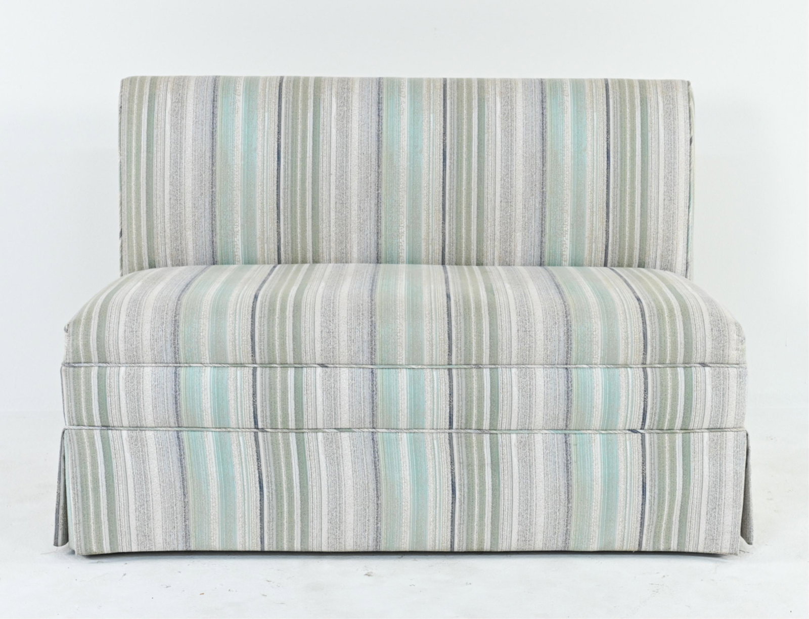 CONTEMPORARY SKIRTED BANQUETTE SETTEE: Dimensions: H 32" x W 48" x D 27.5" Condition: A few areas of soiling to fabric.
