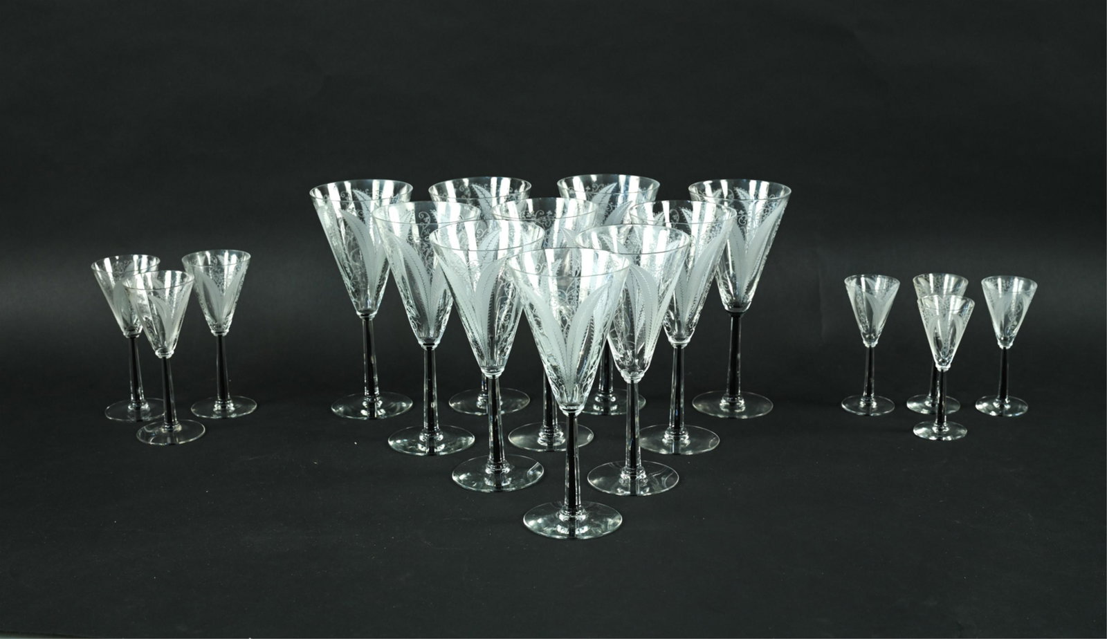 ART DECO MORGANTOWN "FERNLEE" STEMWARE: Rare Art Deco period stemware from the Fernlee pattern by Morgantown, with black core stems. Includes: (10) wine or water goblets, (3) liquor cocktail glasses, and (4) cordial glasses. Dimensions: (Wi