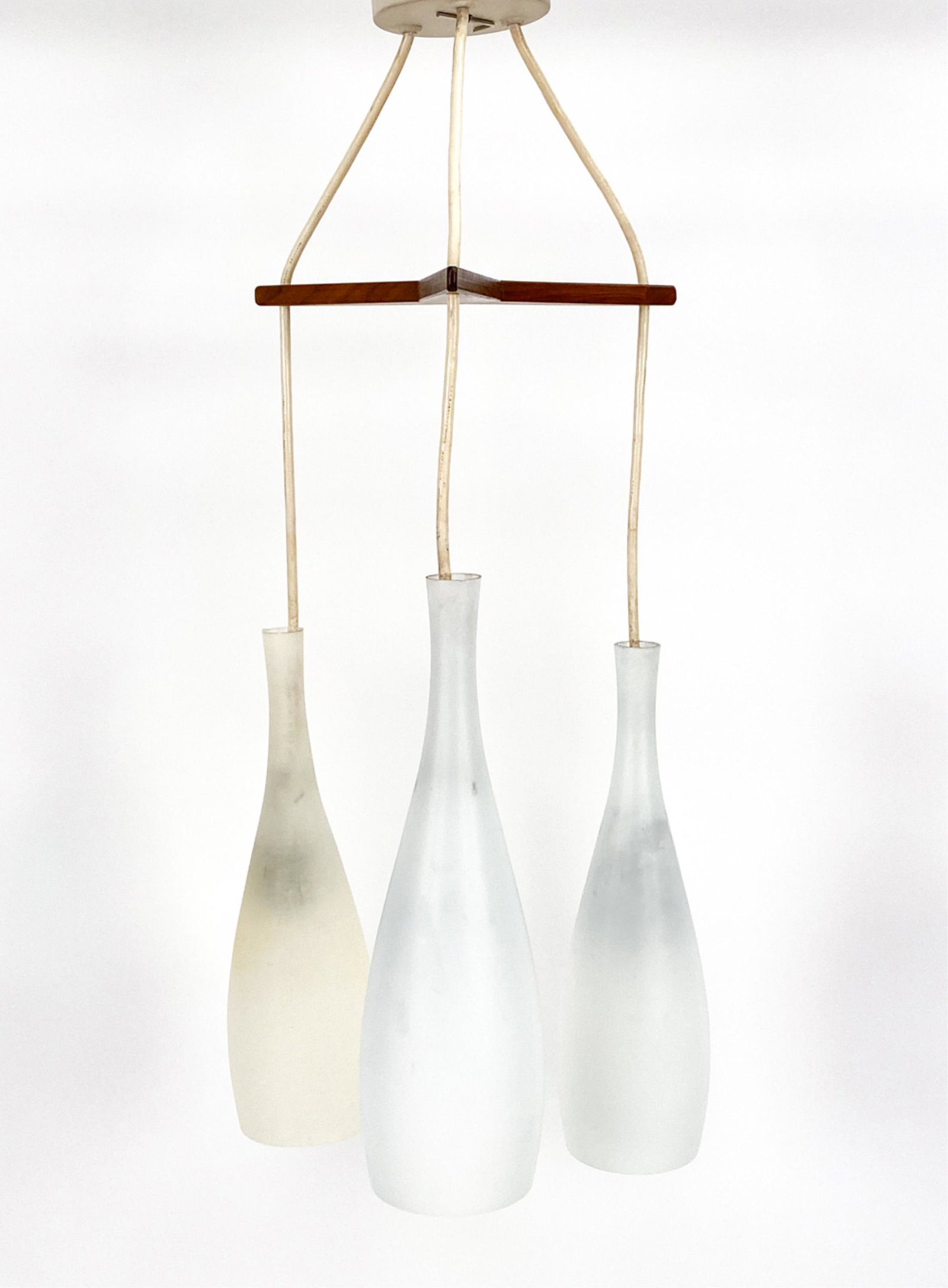 DANISH MODERN PENDANT LAMP: Teak and frosted glass hanging lamp. One glass piece has been replaced. 1960s. Marked "Danish" on underside. Dimensions: H 34" x Dia 12" Condition: Light wear.