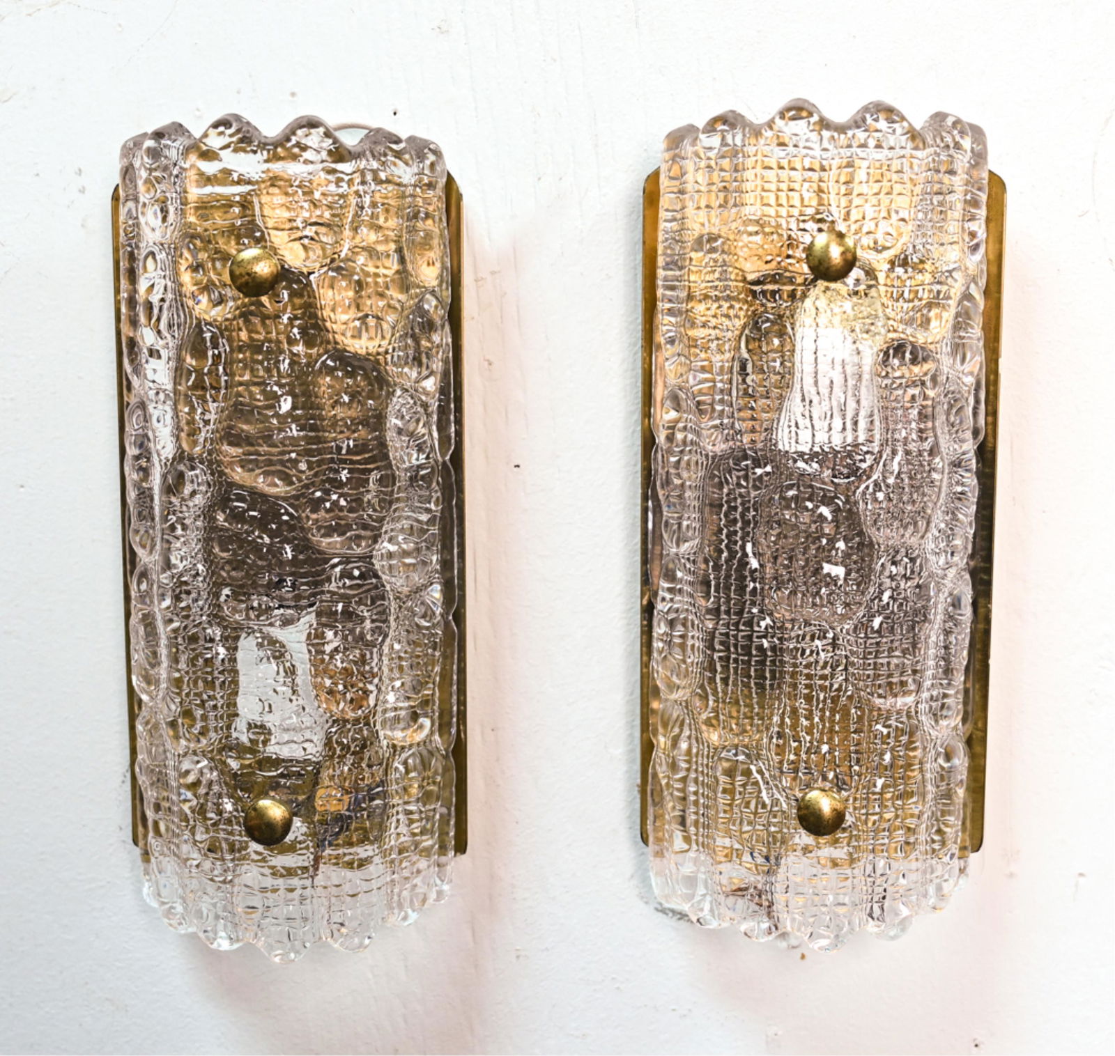 PAIR CARL FAGERLUND ORREFORS WALL SCONCES C.1960: Set of (2) Scandinavian Modern wall sconces designed by Carl Fagerlund for Orrefors / Lyfa. Circa 1950/60. Orrefors glass on brass plate. Both have original Lyfa labels. Dimensions: H 11.25" x W 5" x
