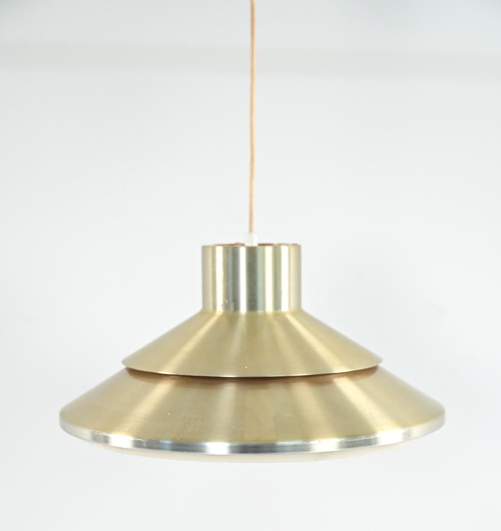 SCANDINAVIAN MID-CENTURY PENDANT LIGHT: In the manner of Jo Hammerborg or Carl Thore. Brass-tone metal with plastic light diffuser underneath. No labels. Dimensions: H 8" x Dia. 15.5" Condition: Few small scattered scuffs, scratches to shad
