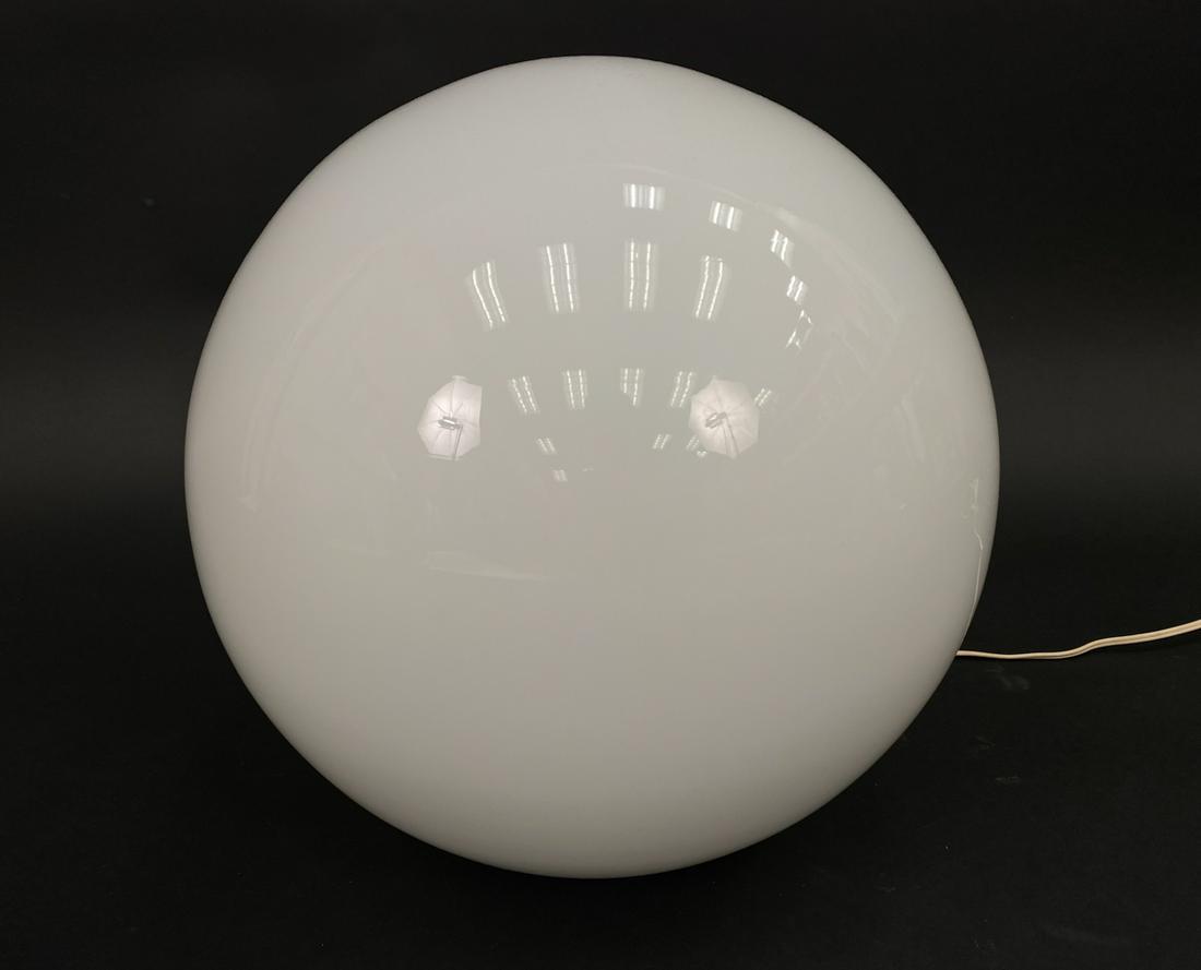 ATTR. BILL CURRY MID-CENTURY BULB/GLOBE LAMP: Glass on white painted metal base. Possibly Bill Curry for Design Line. 1960's. In working condition. Dimensions: H 14" x Dia. 11" Condition: Requires replacement for stem that secures light fixture t