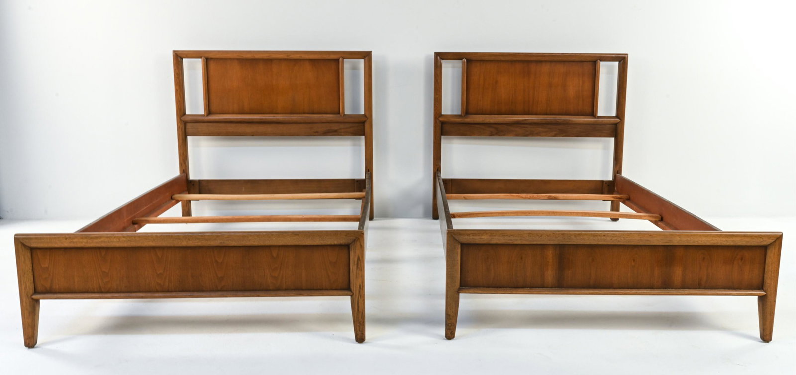 PAIR OF MID-CENTURY TWIN BEDS: Dimensions: H 37" x W 42" x D 80" Condition: Light scuffs and scratches, primarily to side rails.