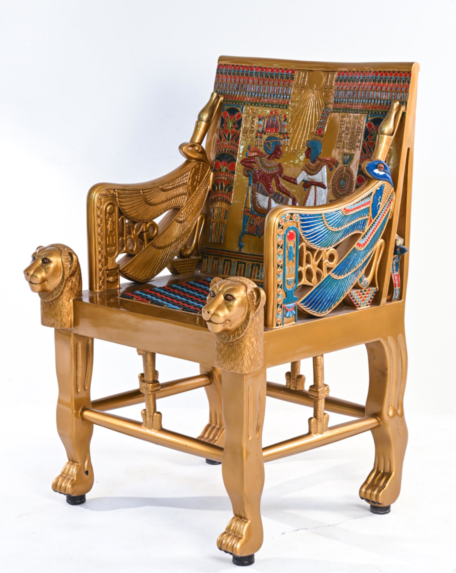 REPRODUCTION EGYPTIAN THRONE OF TUTANKHAMUN: Contemporary reproduction of Throne of Tutankhamun. Dimensions: H 41.25" x W 29.5" x D 26" x SH 20" Condition: Some slight cracking to lacquer finish at seams. Few small nicks and dings. Light handlin