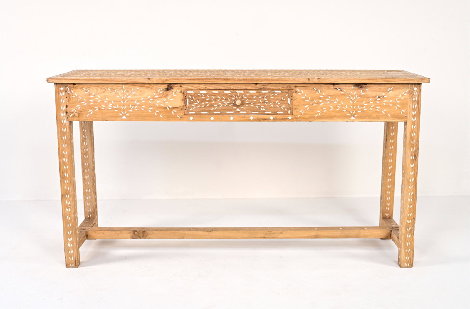 INDIAN BONE INLAID CONSOLE TABLE: C. Late 20th-Early 21st Century, with one drawer. Dimensions: H 31" x W 59" x D 18" Condition: Intentionally rustic/distressed wood finish. Several cracks and splits to wood; a few chips and losses to