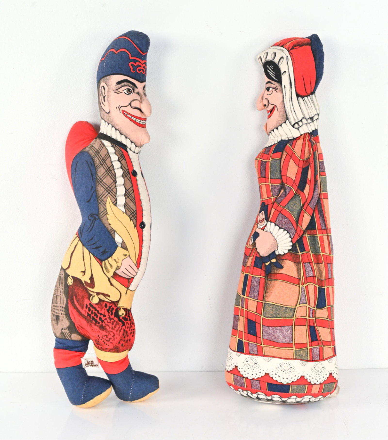 VINTAGE TOY WORKS PUNCH & JUDY CLOTH PLUSH DOLLS: Labeled "The Toy Works" near feet, Punch doll with 1991 copyright on back leg. Dimensions: (Judy) H 24" x W 7.5" x D 5.5" Condition: Minor fading, some surface dust, a few faint spots of discoloration