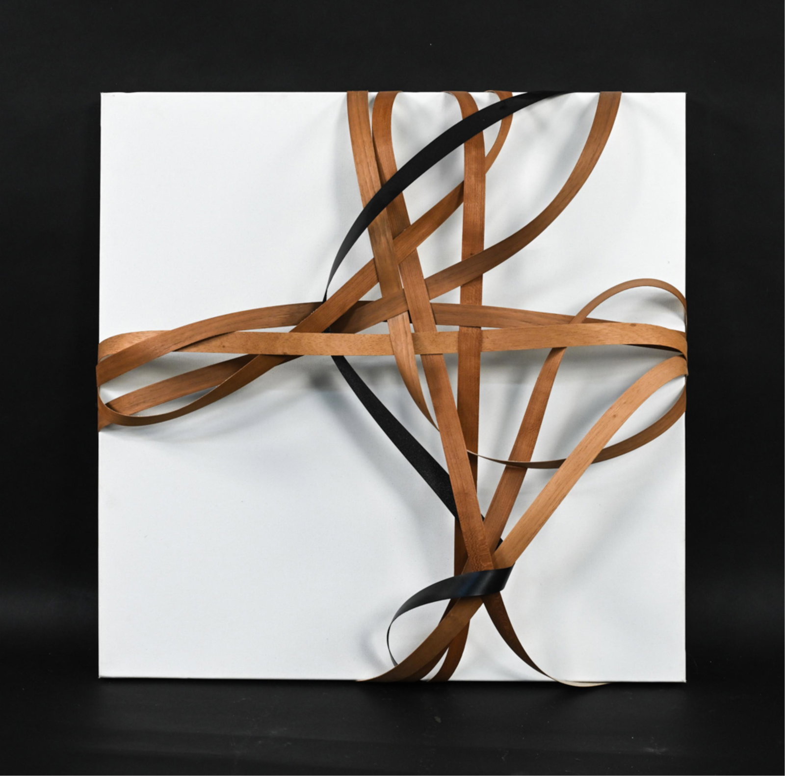 JOSEPH DERMODY ABSTRACT VENEER WALL SCULPTURE: Wood and melamine strips over natural canvas. Signed Joseph Dermody, dated 2014 and titled "no. 3" on upper canvas edge. Dimensions: H 24" x W 24" x D 4.75" Condition: Small cracks to two veneer strip