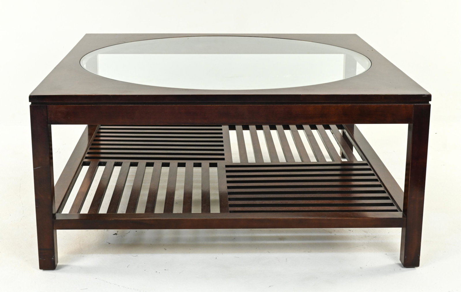 STICKLEY METROPOLITAN COLLECTION COFFEE TABLE: With inset glass and parquet latticework lower tier, c. Late 20th Century. Dimensions: H 19" x W 40" x D 40" Condition: Scattered nicks, dings and scuffs to wood. Normal surface wear consistent with a