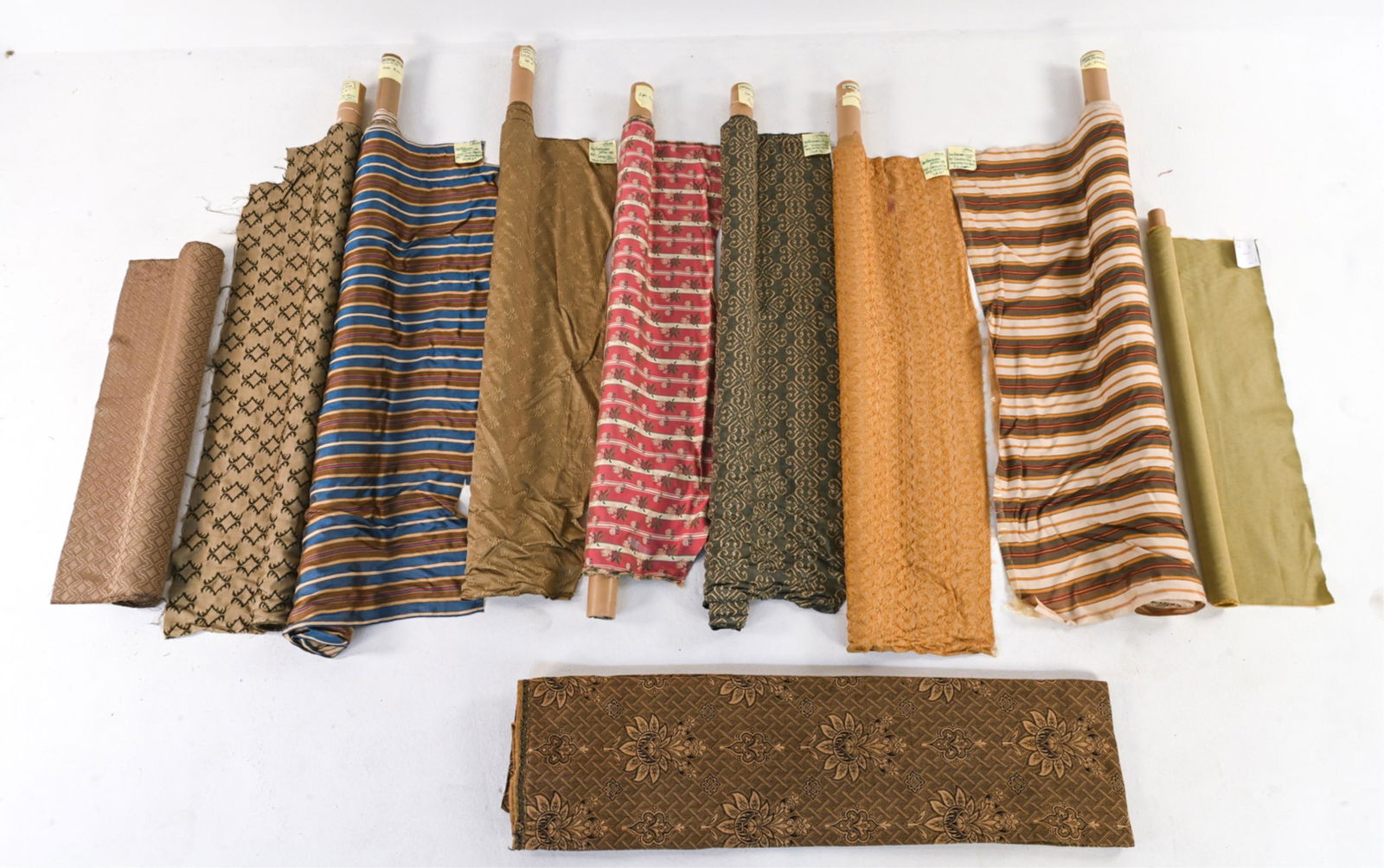 GROUPING OF HAND-WOVEN SILK UPHOLSTERY FABRICS: Including the following hand-woven silk fabrics by San Patrignano Design Lab: "Malmaison Azzuro" and "Malmaison Verde-Oro" striped twill (approx. 10 yards and 9 yards, respectively); "Versailles Oro",