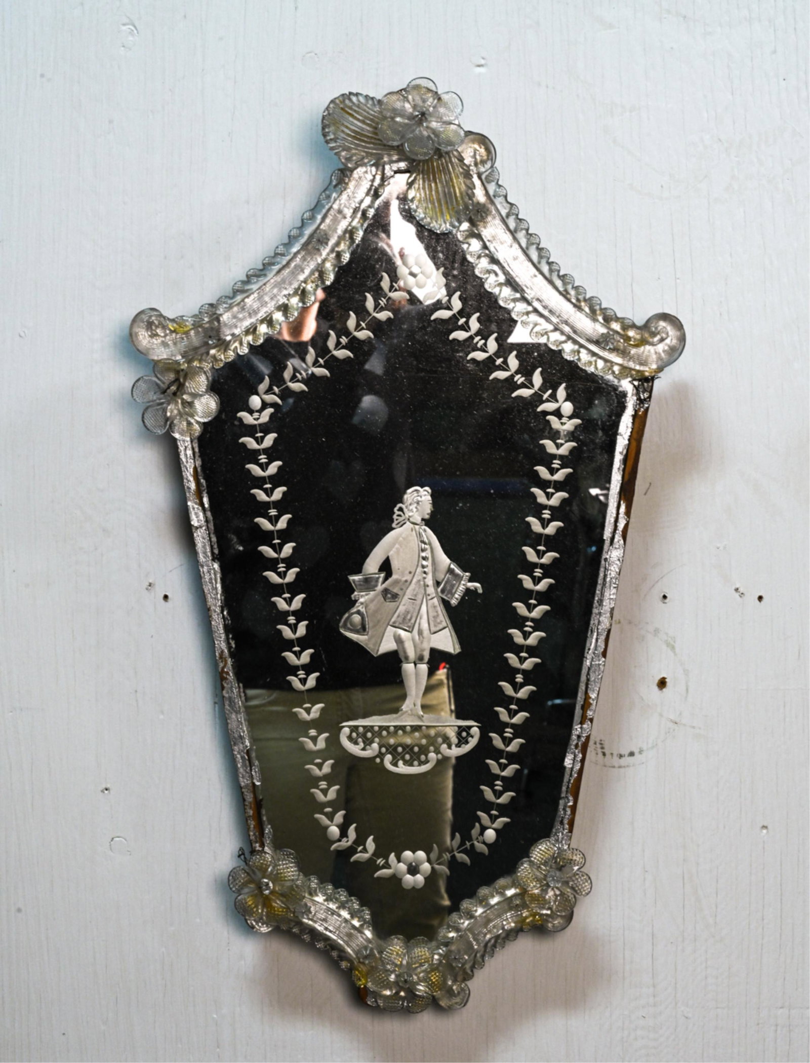 PETITE VENETIAN ETCHED GLASS WALL MIRROR, AS-IS: 20th Century, with figurative motif of a man in 18th century dress. Dimensions: H 23" x W 13.5" Condition: As-is; missing glass applique and trim; a few chips and losses to applique edges.