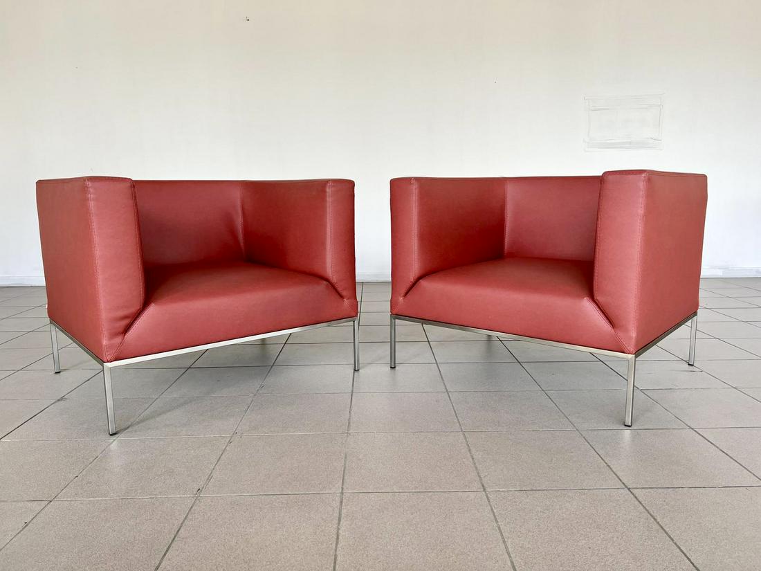PAIR MARCO MARAN ORIGINAL PARRI RED LEATHER CHAIRS: A beautiful pair of Italian Parri (Now Casparini) ON/OFF club lounge chairs with Vintage red toned faux leather upholstery and steel base. Each chair features a square-shaped structure with a deep sea